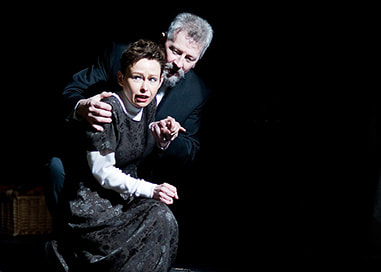 Two actors on stage - man and woman - from The Crucible